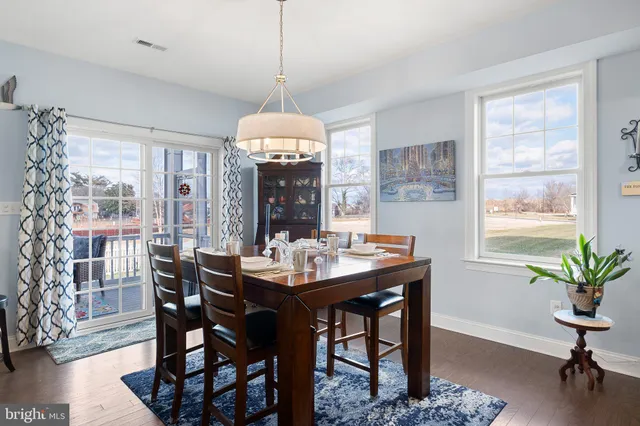 a living room with furniture tv and a large window