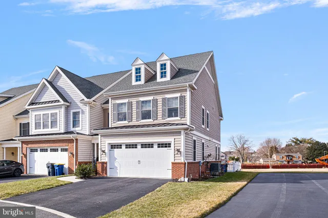 an aerial view of a house with a ocean view