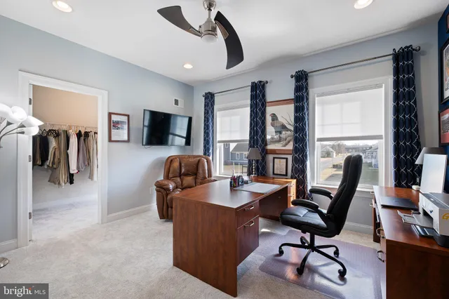 a view of a garden and buildings in the background