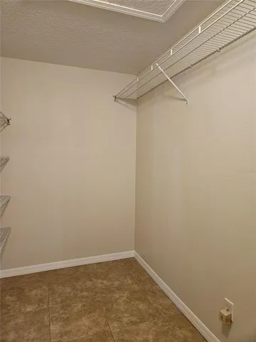 a view of an empty walk in closet