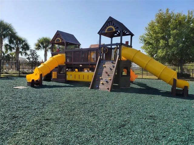 a view of a balcony with two chairs and a table