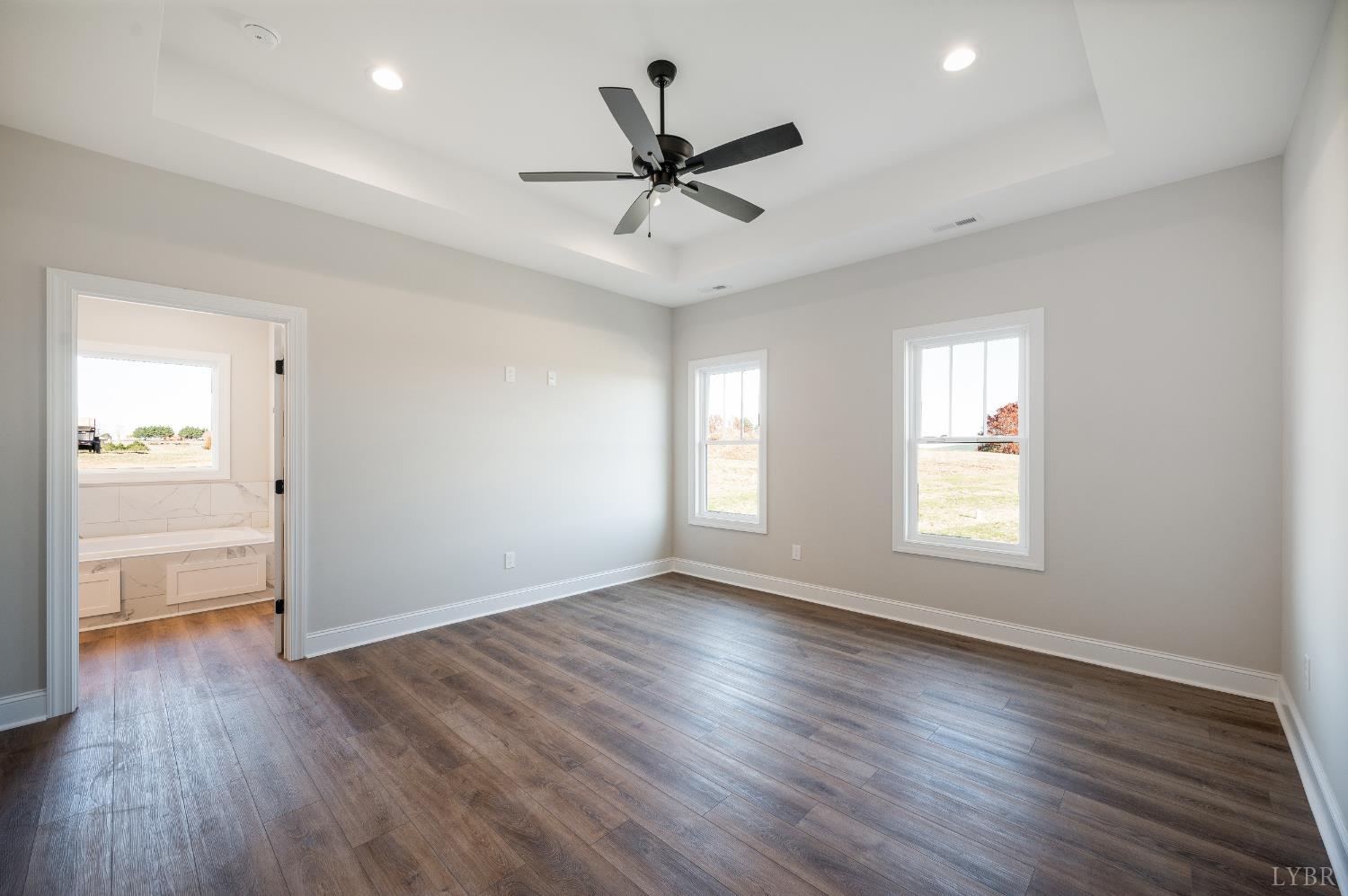 10402 Leesville Road Lynch Station, VA 24571 - Photo 21 of 45 a view of an empty room with wooden floor and a window