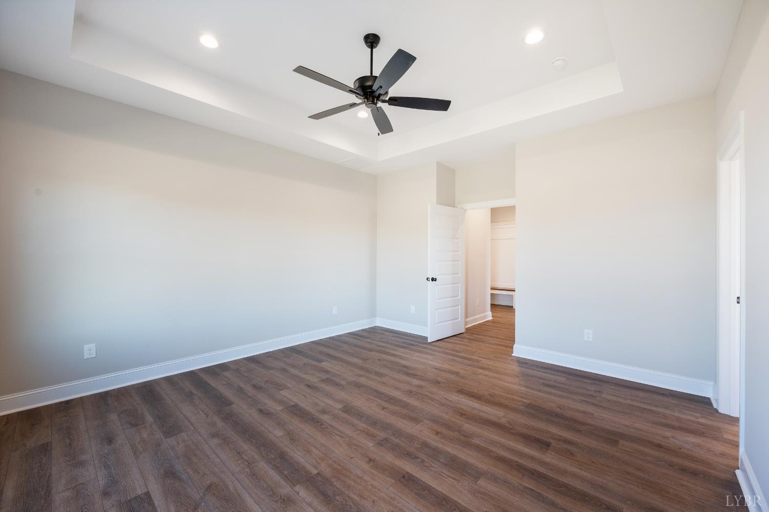 10402 Leesville Road Lynch Station, VA 24571 - Photo 22 of 45 a view of empty room with wooden floor and ceiling fan