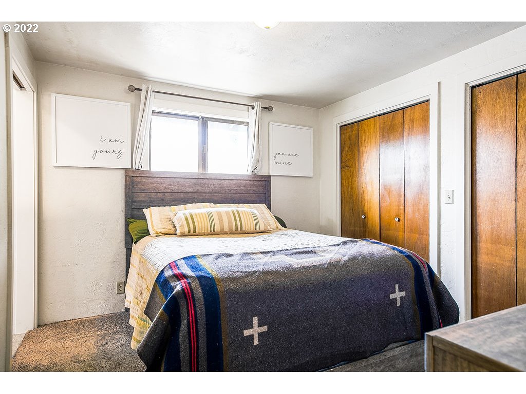 581 36th Street Springfield, OR 97478 - Photo 20 of 32 a bedroom with a bed and wooden floor