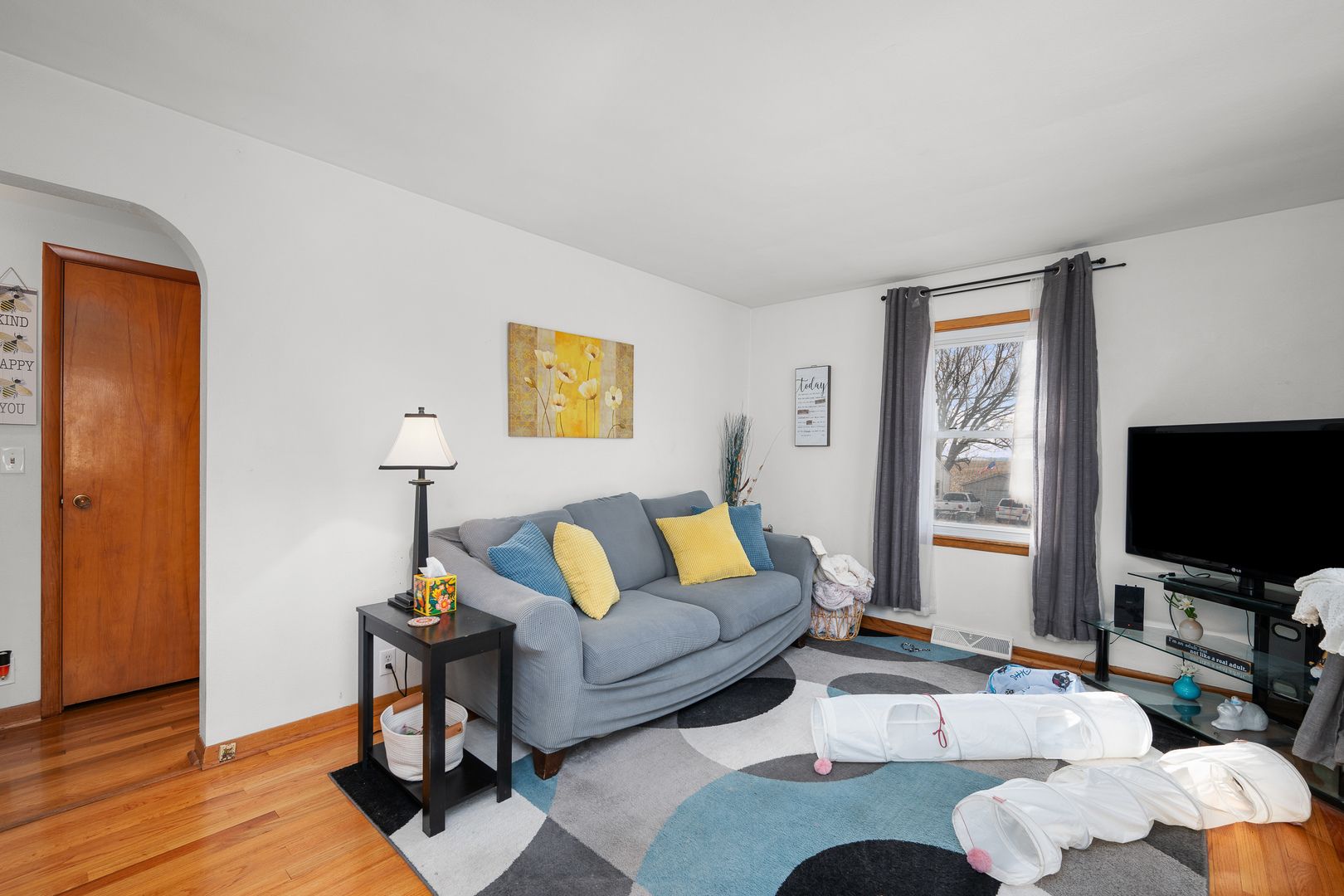 13627 138th Street West Taylor Ridge, IL 61284 - Photo 2 of 23 a living room with furniture and a flat screen tv