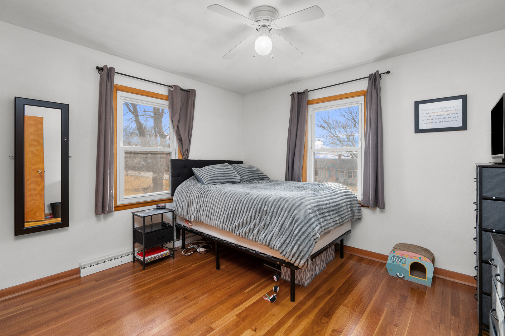 13627 138th Street West Taylor Ridge, IL 61284 - Photo 8 of 23 a bedroom with a bed and wooden floor
