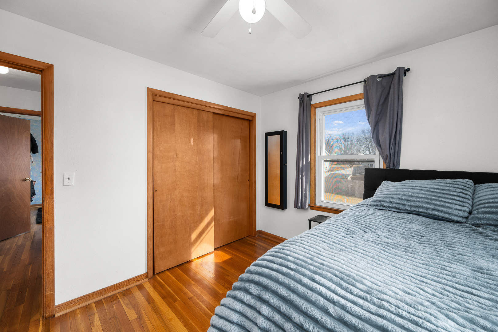 13627 138th Street West Taylor Ridge, IL 61284 - Photo 10 of 23 a bedroom with a bed and a window