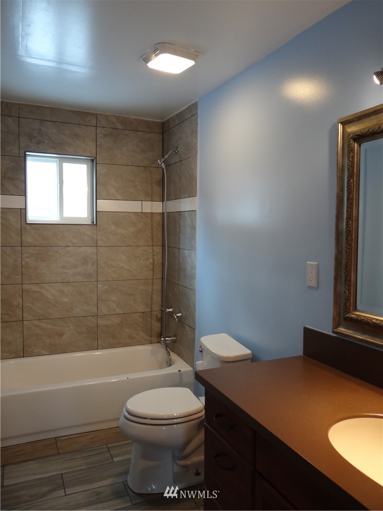 1306 Riverside Avenue Twisp, WA 98856 - Photo 15 of 22 a bathroom with a sink a toilet and shower