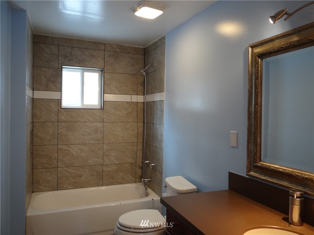 1306 Riverside Avenue Twisp, WA 98856 - Photo 16 of 22 a bathroom with a sink toilet and shower