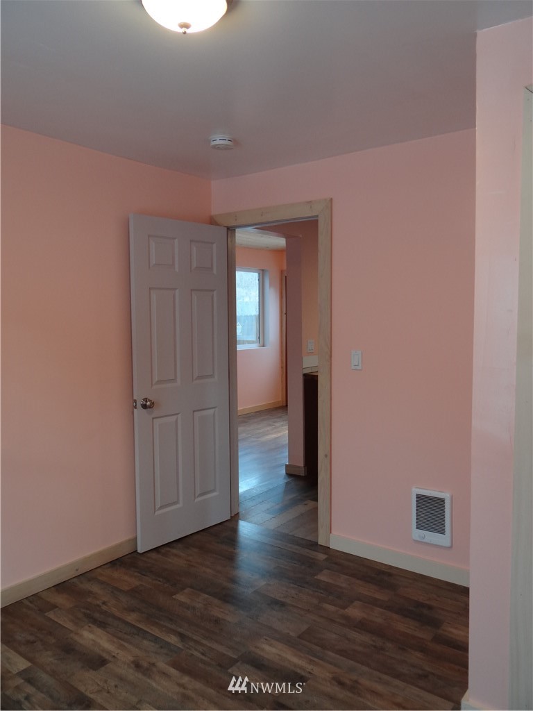 1306 Riverside Avenue Twisp, WA 98856 - Photo 18 of 22 a view of a hallway with wooden floor
