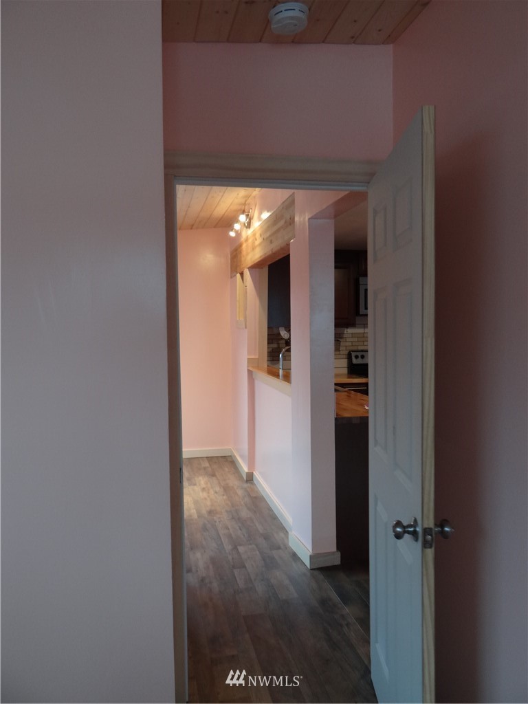 1306 Riverside Avenue Twisp, WA 98856 - Photo 21 of 22 a view of a hallway with wooden shelves