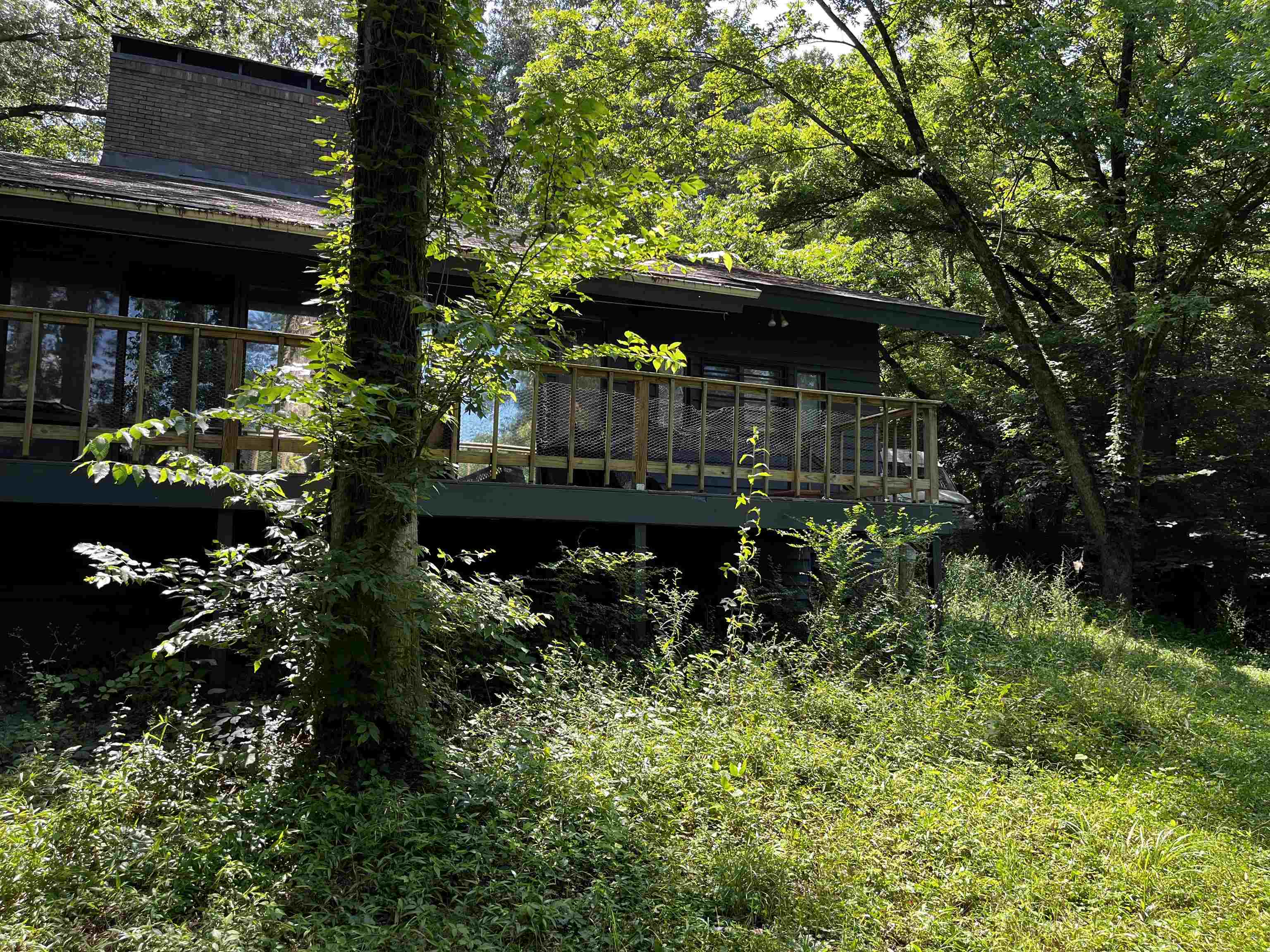 4258 Old Brownsville Road Memphis, TN 38135 - Photo 8 of 40 a view of backyard with a table and chairs and potted plants