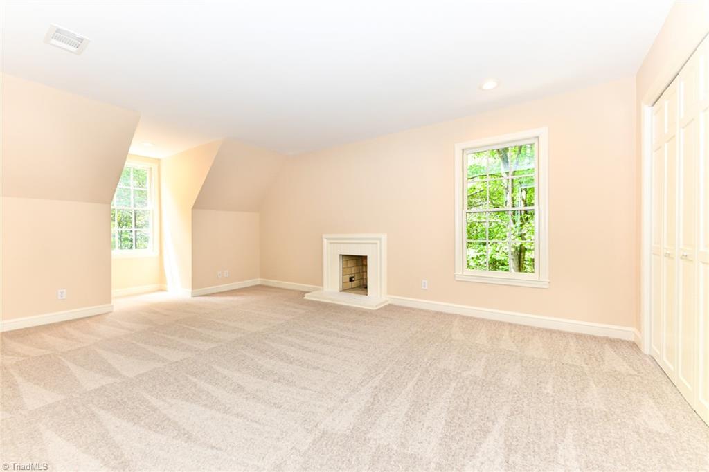 320 Homestead Avenue High Point, NC 27262 - Photo 16 of 31 Bedroom 2 is located on the 2nd floor. This room is equipped with fresh paint, abundance of light, new carpet, and a wood burning fireplace.
