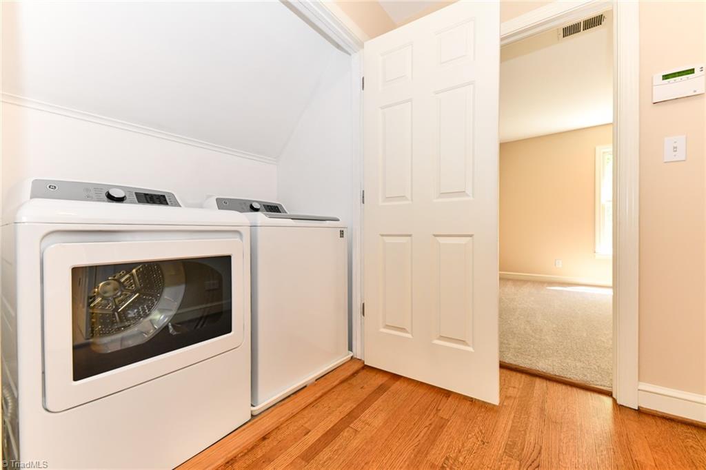 320 Homestead Avenue High Point, NC 27262 - Photo 21 of 31 The washer and dryer is located in the hall on the upper level between bedrooms 2 and 3.