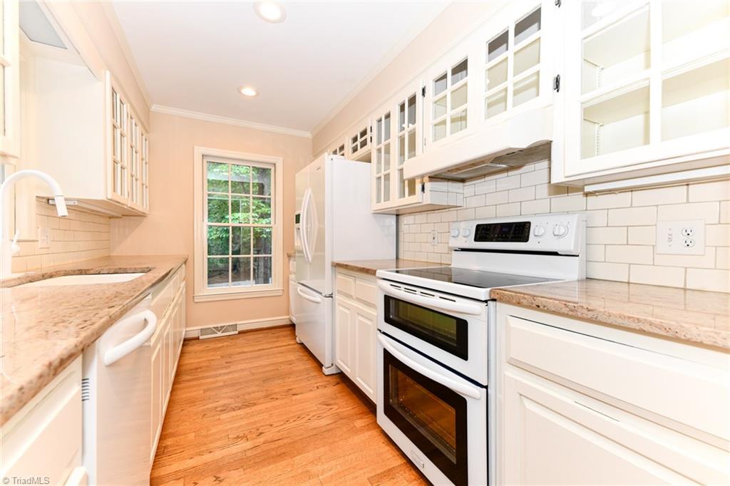 320 Homestead Avenue High Point, NC 27262 - Photo 9 of 31 This galley kitchen creates the primary work triangle - path made when moving from the refrigerator to the sink, to the range when preparing a meal. Granite countertops, new faucet, and newer Kitchen Aid appliances
