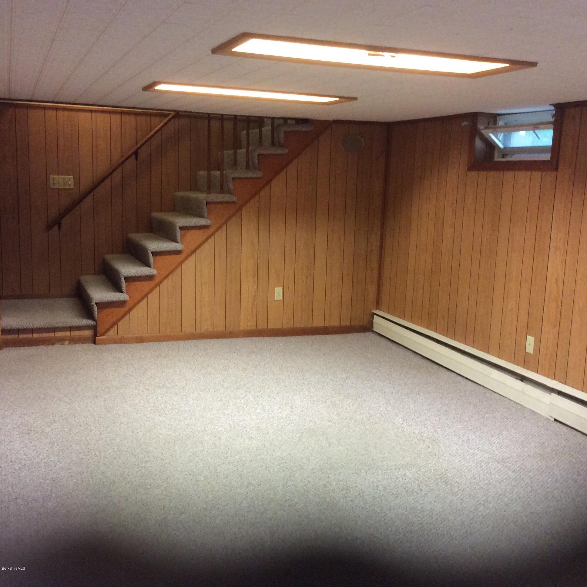 99 Bushey Road Pittsfield, MA 01201 - Photo 9 of 11 Basement playroom and stairs