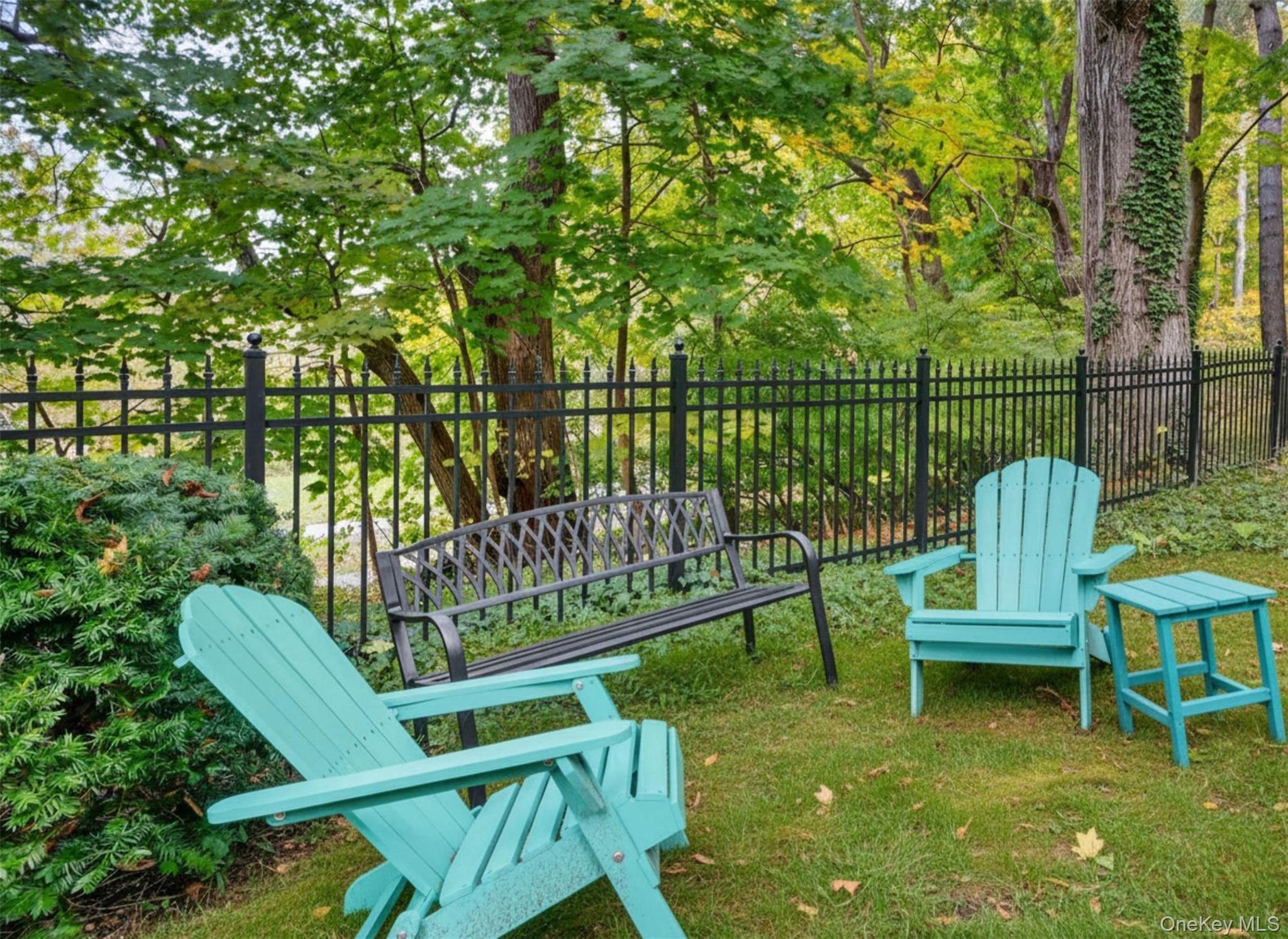 1 Rivermere, Unit I Bronxville, NY 10708 - Photo 12 of 20 a view of a chair and table in the garden