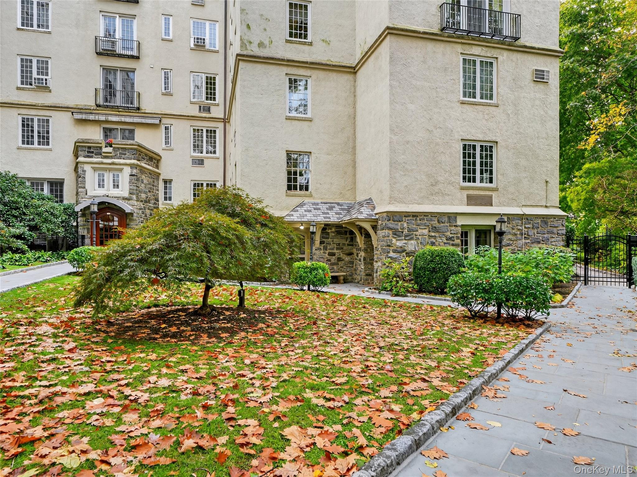 1 Rivermere, Unit I Bronxville, NY 10708 - Photo 13 of 20 a view of a house with a yard
