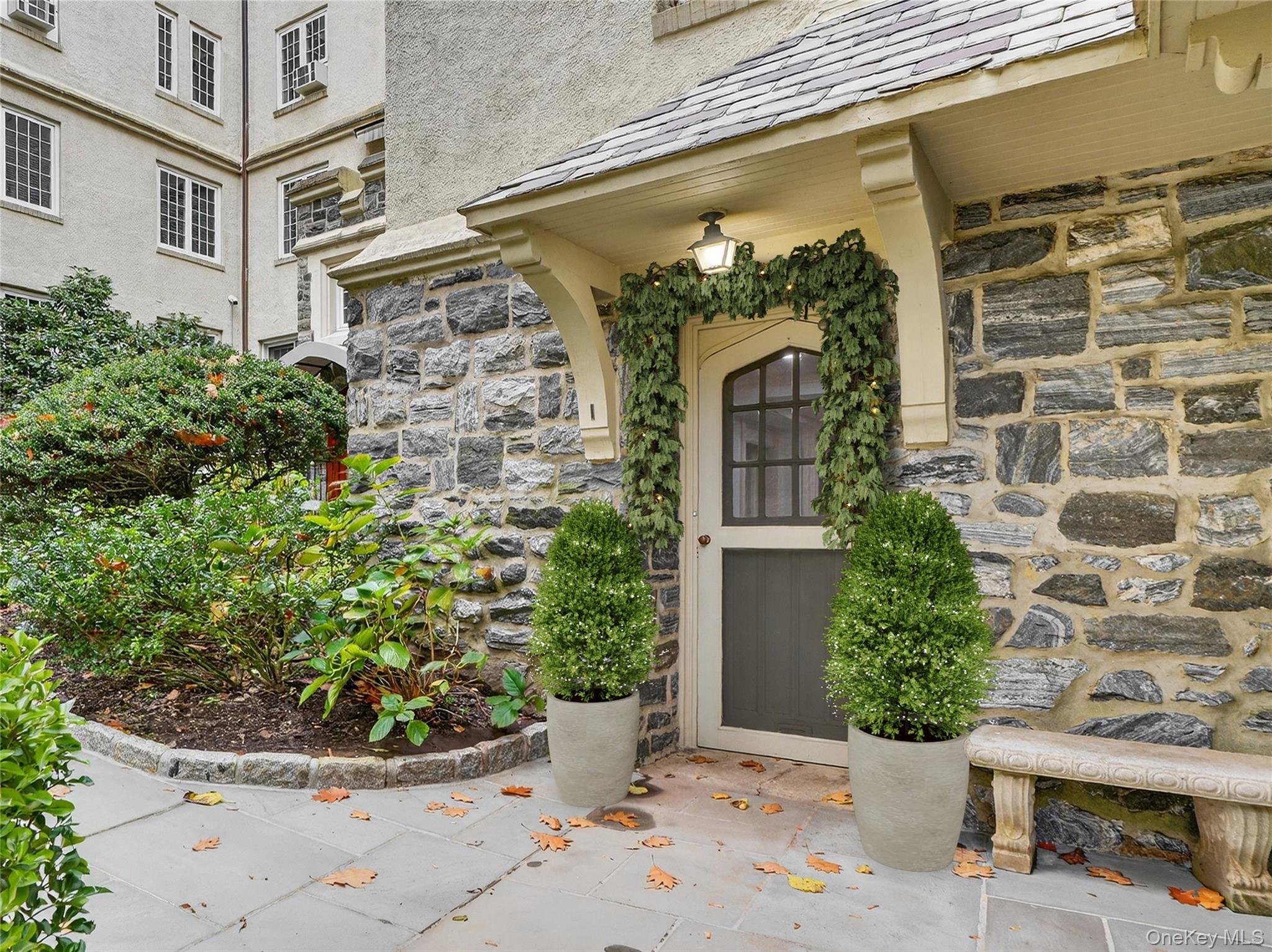 1 Rivermere, Unit I Bronxville, NY 10708 - Photo 17 of 20 a view of a potted plant in front of a door
