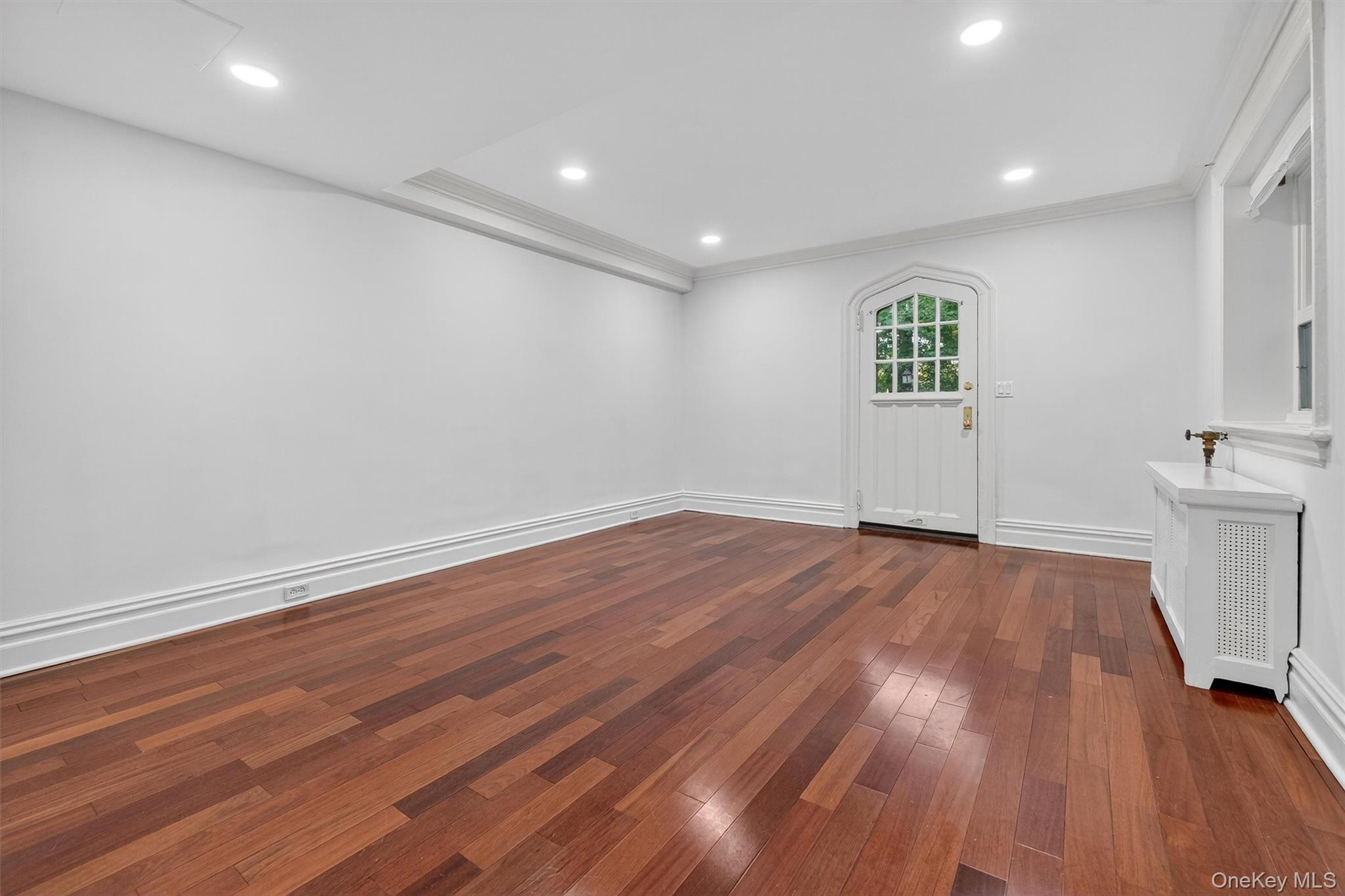 1 Rivermere, Unit I Bronxville, NY 10708 - Photo 3 of 20 an empty room with wooden floor and window