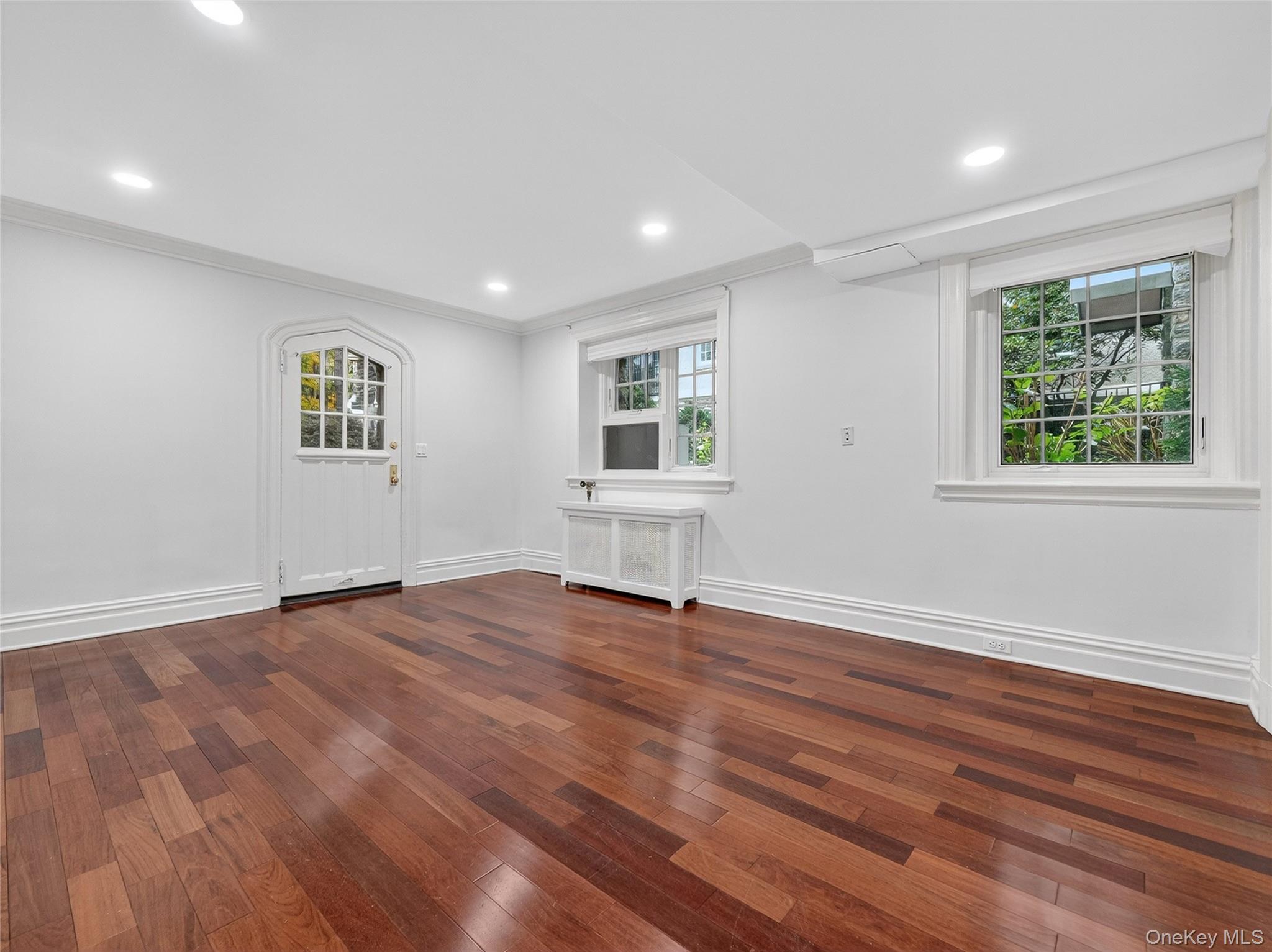 1 Rivermere, Unit I Bronxville, NY 10708 - Photo 4 of 20 a view of an empty room with wooden floor and a window