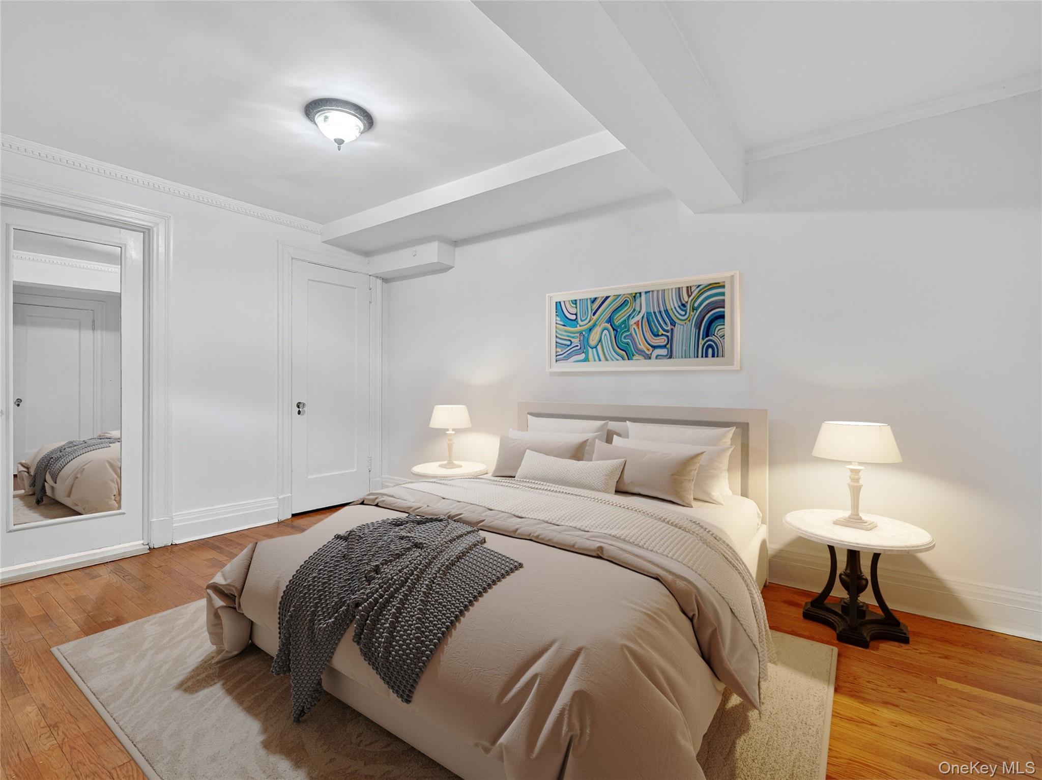 1 Rivermere, Unit I Bronxville, NY 10708 - Photo 8 of 20 a bedroom with a bed and a lamp