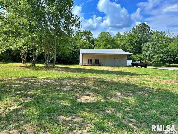 a view of a house with a big yard