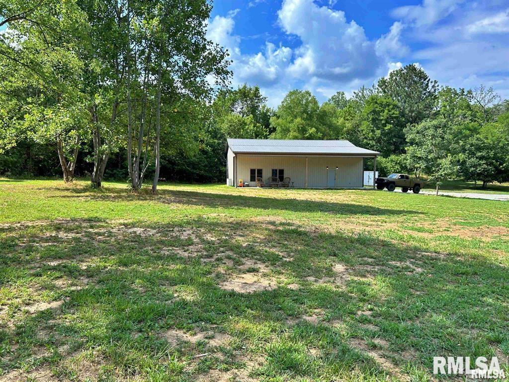 a view of a house with a big yard