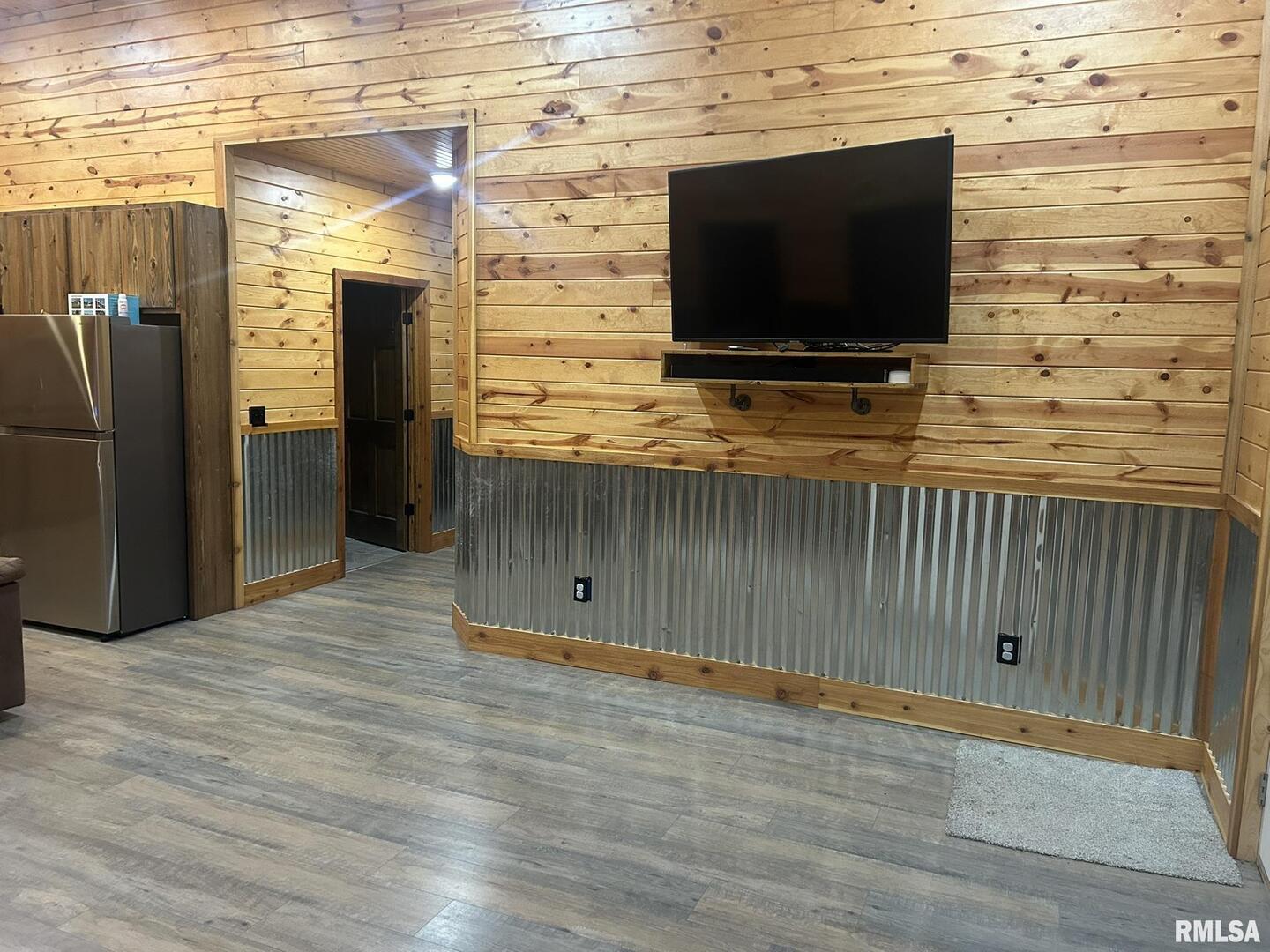 40 Presley Loop Golconda, IL 62938 - Photo 14 of 40 a view of empty room with wooden floor and tv