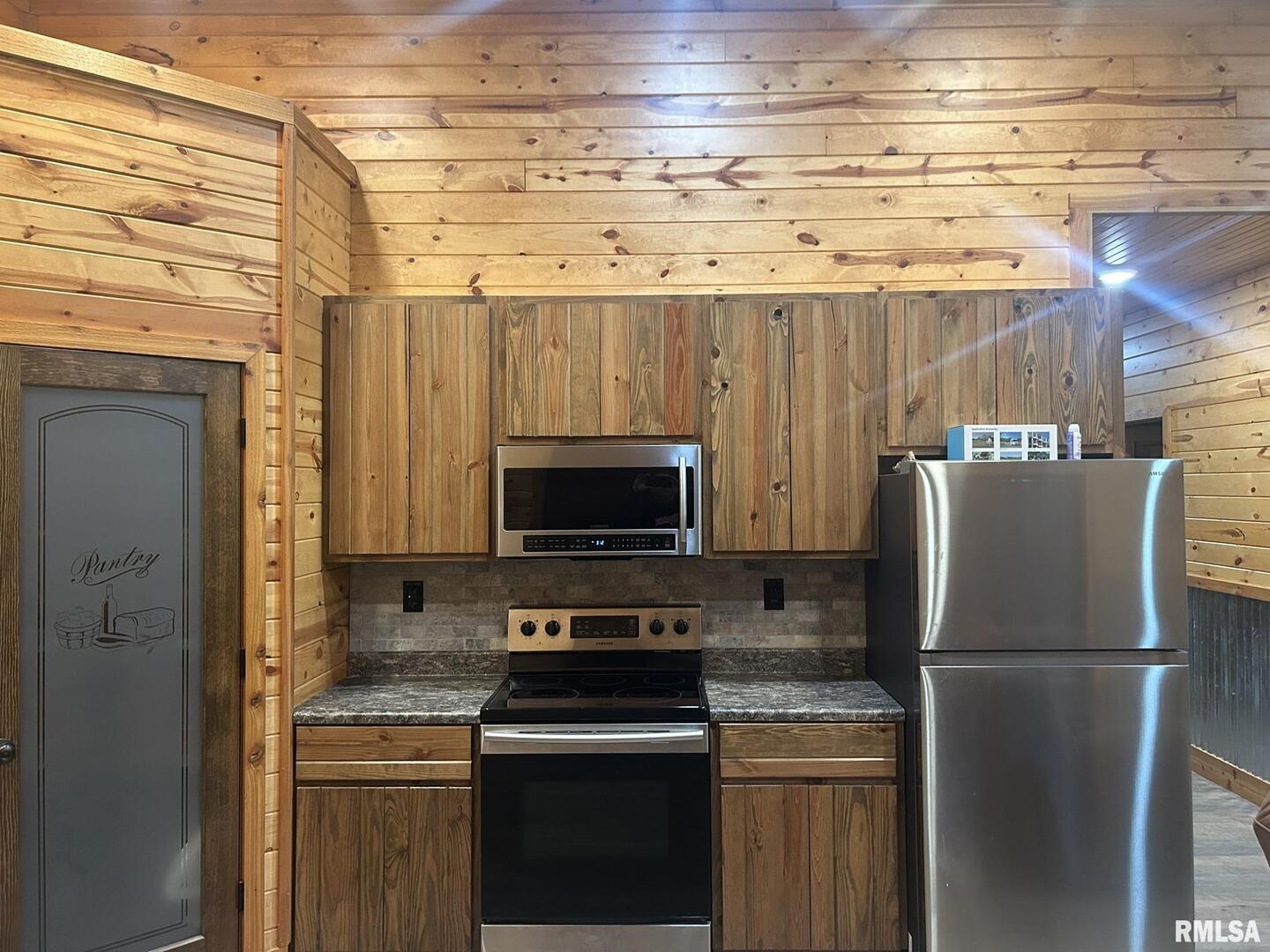 40 Presley Loop Golconda, IL 62938 - Photo 15 of 40 a kitchen with a refrigerator a stove and a microwave