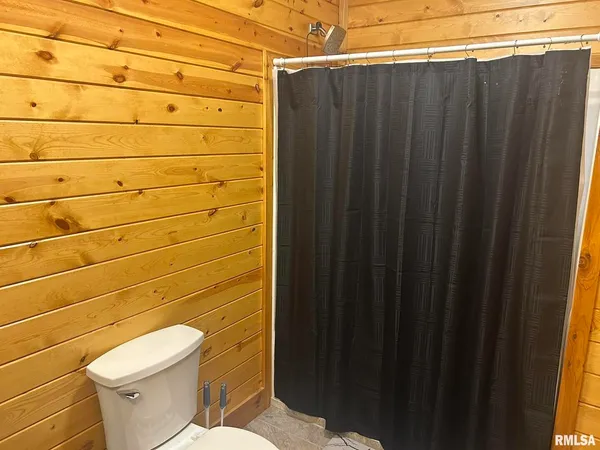 a bathroom with a toilet and a sink