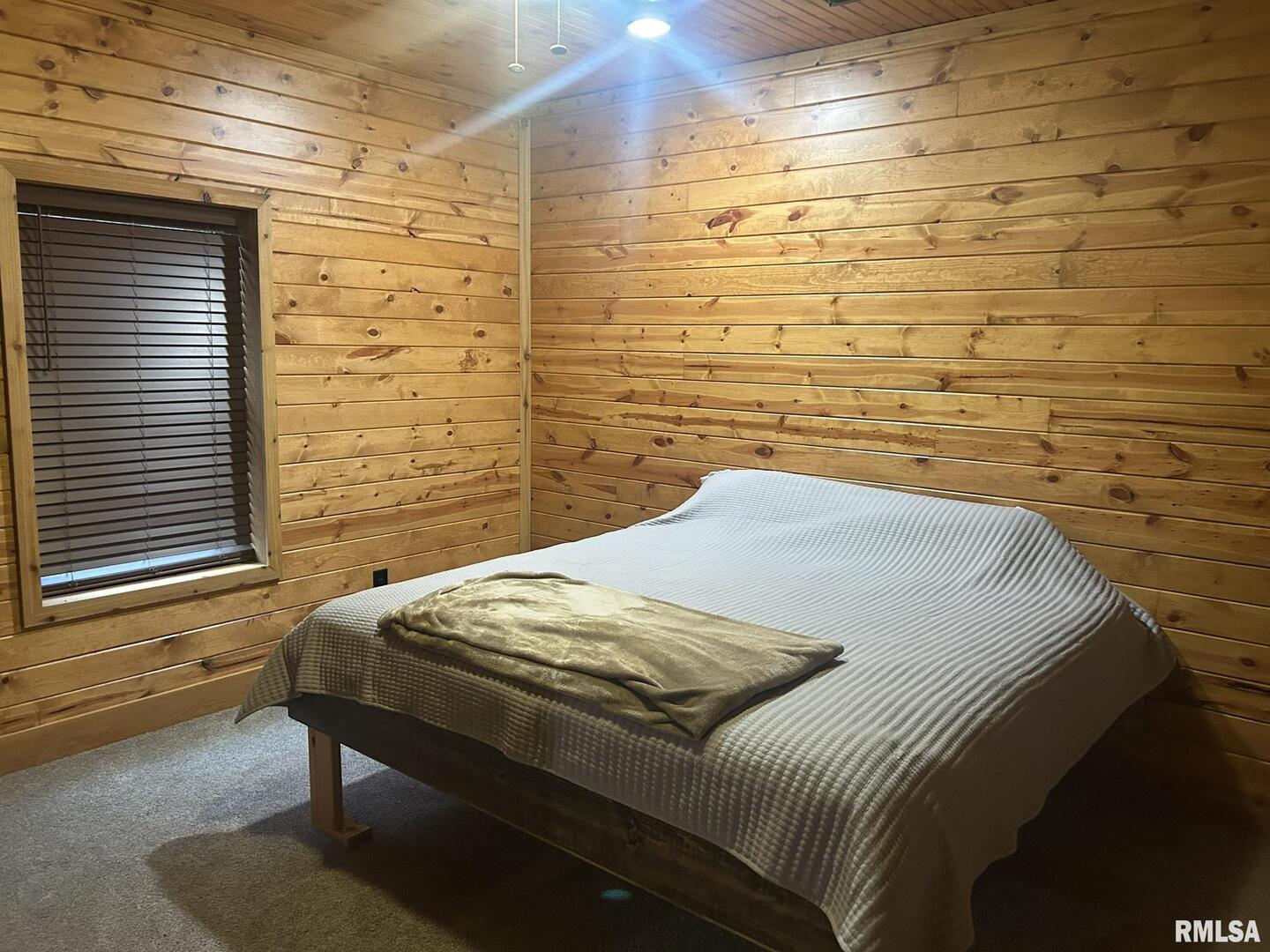 40 Presley Loop Golconda, IL 62938 - Photo 28 of 40 a bedroom with a bed and a chandelier