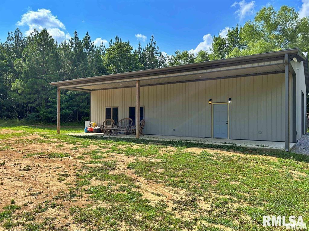 40 Presley Loop Golconda, IL 62938 - Photo 3 of 40 a backyard of a house with table and chairs