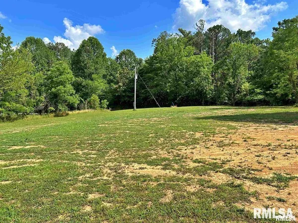 a view of a field with an outdoor space