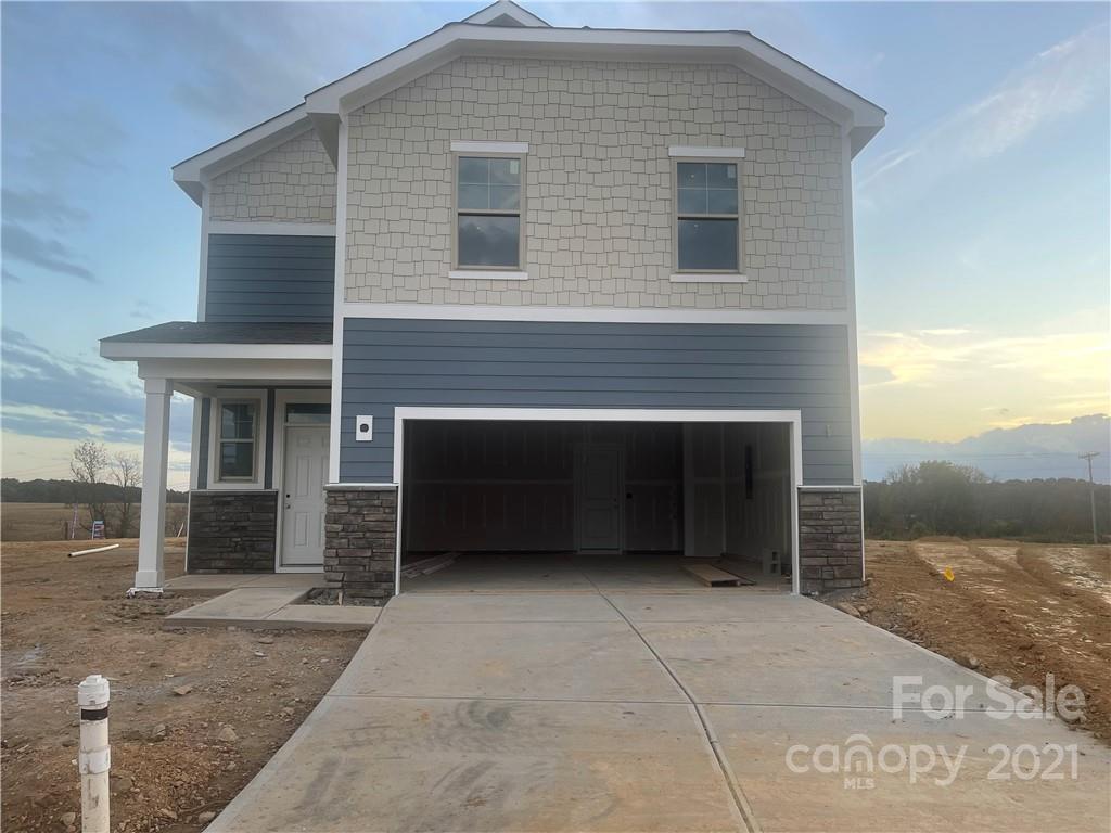 1019 Maylen Trace, Unit 164 Monroe, NC 28110 - Photo 1 of 4 a front view of a house with a yard