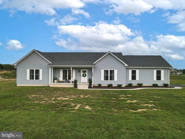 a house with a big yard and front view of a house