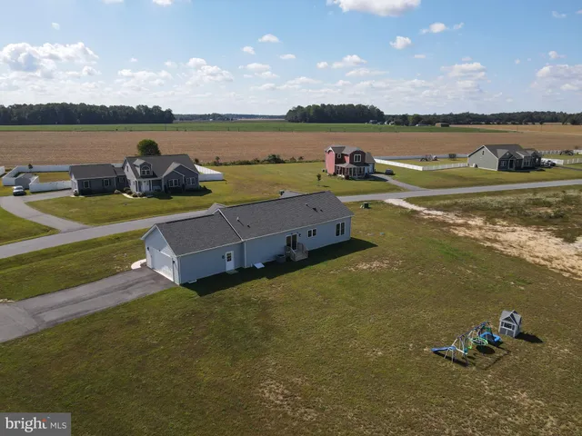 a view of a lake with a table and chairs