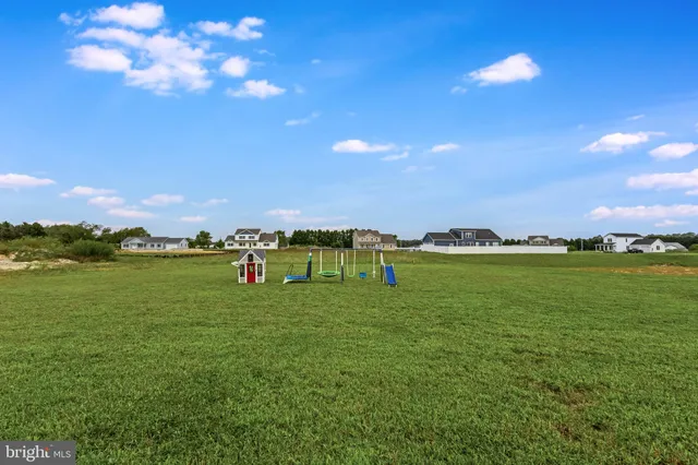 a view of a golf course with a lake