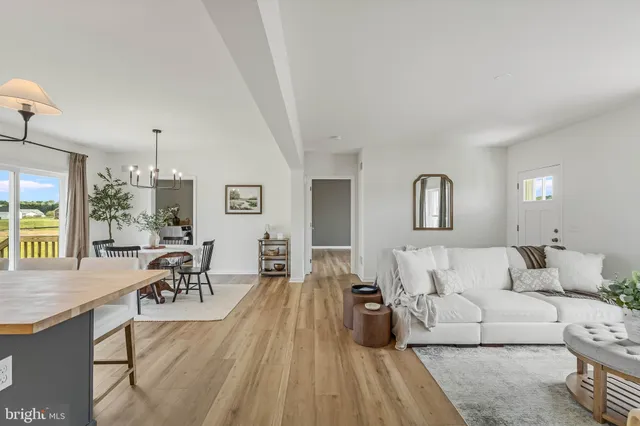 a living room with furniture and a table