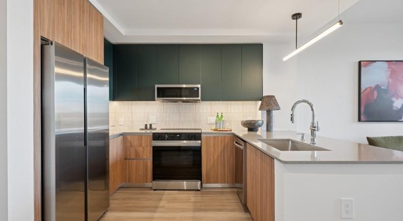 660 11th Street Northwest, Unit 503 Atlanta, GA 30318 - Photo 1 of 45 a kitchen with stainless steel appliances granite countertop a refrigerator and a sink