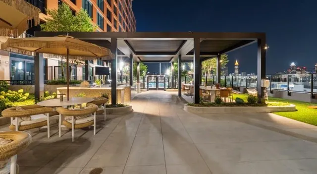 a swimming pool with outdoor seating