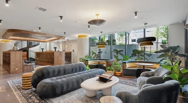 a living room with furniture and a rug