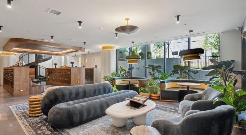 660 11th Street Northwest, Unit 503 Atlanta, GA 30318 - Photo 33 of 45 a living room with furniture and a large window