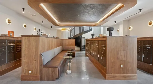 a view of a dining room with furniture and chandelier