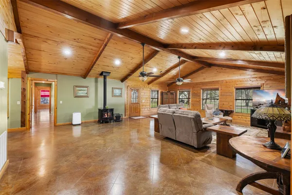 a living room with furniture and a chandelier