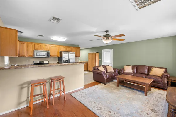 a kitchen that has a cabinets and a stove top oven