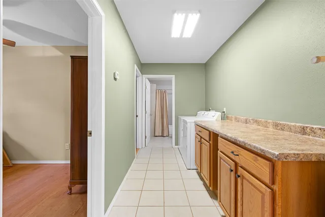a bathroom with a shower a toilet and a sink