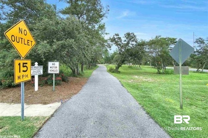 430 West Fort Morgan Road, Unit 1902 Gulf Shores, AL 36542 - Photo 46 of 59 View of community featuring a lawn