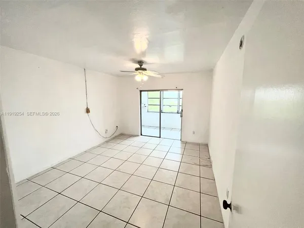 a view of an empty room and window