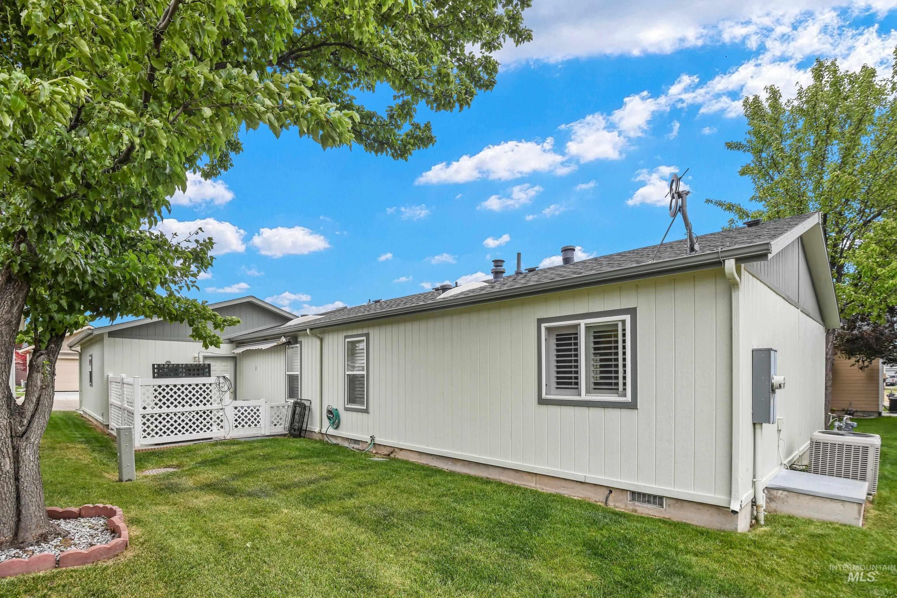 421 South Curtis Road, Unit 202 202 Boise, ID 83705 - Photo 25 of 41 Outdoor patio area featuring a lattice privacy fence, paved surface, and direct exterior access